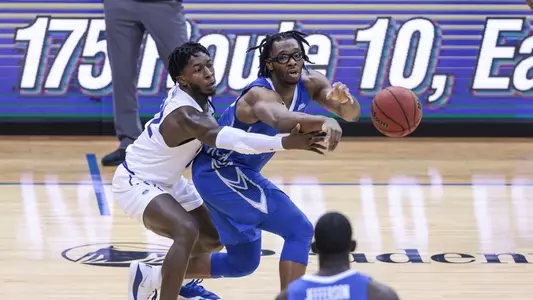 Jan 27, 2021; Newark, New Jersey, USA; Creighton Bluejays guard Denzel Mahoney (34) passes the ball to forward Damien Jefferson (23) as Seton Hall Pirates guard Myles Cale (22) defends during the first half at Prudential Center. Mandatory Credit: Vincent Carchietta-USA TODAY Sports