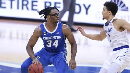 Jan 27, 2021; Newark, New Jersey, USA; Creighton Bluejays guard Denzel Mahoney (34) dribbles as Seton Hall Pirates guard Bryce Aiken (1) defends during the second half at Prudential Center. Mandatory Credit: Vincent Carchietta-USA TODAY Sports