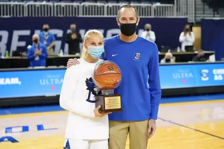 Temi Carda 1,000 point ball with Jim Flanery