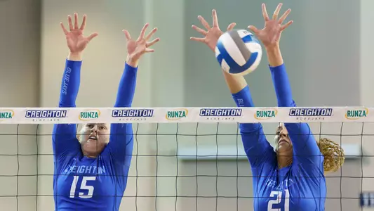 Kendra Wait and Naomi Hickman block