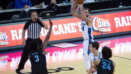 Feb 13, 2021; Omaha, Nebraska, USA;  Creighton Bluejays guard Mitch Ballock (24) scores a three point basket over Villanova Wildcats forward Brandon Slater (3) in the second half at CHI Health Center Omaha. Mandatory Credit: Steven Branscombe-USA TODAY Sports