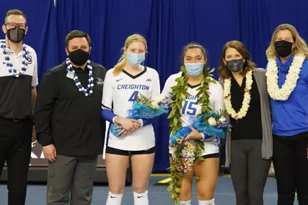 VB Senior Day photo with coaches