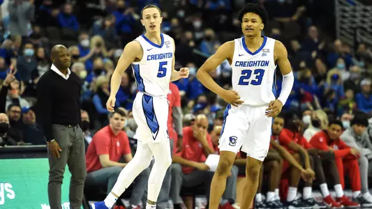 Jan 19, 2022; Omaha, Nebraska, USA;  Creighton Bluejays guard Trey Alexander (23) and guard Alex O'Connell (5) celebrate a three point basket against the St. John's Red Storm in the second half at CHI Health Center Omaha. Mandatory Credit: Steven Branscombe-USA TODAY Sports