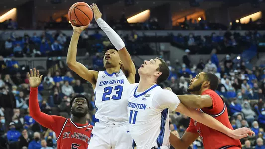 Jan 19, 2022; Omaha, Nebraska, USA;  Creighton Bluejays guard Trey Alexander (23) drives against St. John's Red Storm guard Dylan Addae-Wusu (5) in the second half at CHI Health Center Omaha. Mandatory Credit: Steven Branscombe-USA TODAY Sports