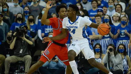 Jan 19, 2022; Omaha, Nebraska, USA;  Creighton Bluejays forward Arthur Kaluma (24) drives against St. John's Red Storm guard Stef Smith (3) in the first half at CHI Health Center Omaha. Mandatory Credit: Steven Branscombe-USA TODAY Sports