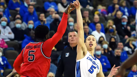 Jan 19, 2022; Omaha, Nebraska, USA;  Creighton Bluejays guard Alex O'Connell (5) attempts a three point shot against St. John's Red Storm guard Dylan Addae-Wusu (5) in the second half at CHI Health Center Omaha. Mandatory Credit: Steven Branscombe-USA TODAY Sports