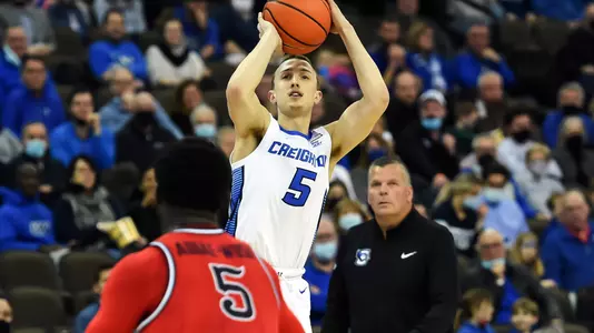 Jan 19, 2022; Omaha, Nebraska, USA;  Creighton Bluejays guard Alex O'Connell (5) attempts a three point shot against St. John's Red Storm guard Dylan Addae-Wusu (5) in the second half at CHI Health Center Omaha. Mandatory Credit: Steven Branscombe-USA TODAY Sports