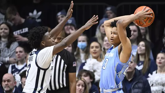 Jan 26, 2022; Indianapolis, Indiana, USA; Creighton Bluejays guard Trey Alexander (23) looks to get a ball around Butler Bulldogs guard Chuck Harris (3) during the first half at Hinkle Fieldhouse. Mandatory Credit: Marc Lebryk-USA TODAY Sports