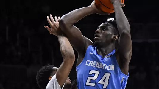 Jan 26, 2022; Indianapolis, Indiana, USA; Creighton Bluejays forward Arthur Kaluma (24) shoots over Butler Bulldogs guard Chuck Harris (3) during the second half at Hinkle Fieldhouse. Bulldogs won 72-55. Mandatory Credit: Marc Lebryk-USA TODAY Sports
