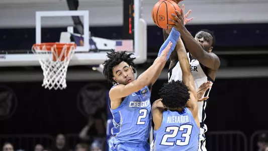 Jan 26, 2022; Indianapolis, Indiana, USA; Butler Bulldogs guard Bo Hodges (1) grabs a ball over Creighton Bluejays guard Ryan Nembhard (2) and guard Trey Alexander (23) during the second half at Hinkle Fieldhouse. Bulldogs won 72-55. Mandatory Credit: Marc Lebryk-USA TODAY Sports