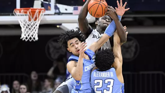 Jan 26, 2022; Indianapolis, Indiana, USA; Butler Bulldogs guard Bo Hodges (1) grabs a ball over Creighton Bluejays guard Ryan Nembhard (2) and guard Trey Alexander (23) during the second half at Hinkle Fieldhouse. Bulldogs won 72-55. Mandatory Credit: Marc Lebryk-USA TODAY Sports