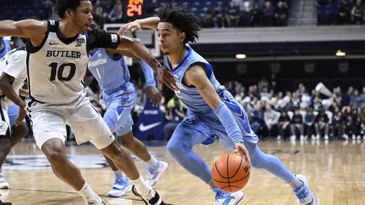 Jan 26, 2022; Indianapolis, Indiana, USA; Creighton Bluejays guard Ryan Nembhard (2) pushes toward the basket against Butler Bulldogs forward Bryce Nze (10) during the second half at Hinkle Fieldhouse. Bulldogs won 72-55. Mandatory Credit: Marc Lebryk-USA TODAY Sports
