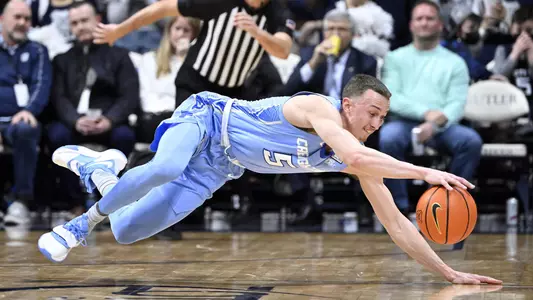 Jan 26, 2022; Indianapolis, Indiana, USA; Creighton Bluejays guard Alex O'Connell (5) dives to keep a ball from going out of bounds during the second half of the game against the Butler Bulldogs at Hinkle Fieldhouse. Bulldogs won 72-55. Mandatory Credit: Marc Lebryk-USA TODAY Sports