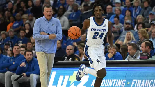 Nov 7, 2022; Omaha, Nebraska, USA;  Creighton Bluejays forward Arthur Kaluma (24) dribbles up court against the St. Thomas - Minnesota Tommies during the first half at CHI Health Center Omaha. Mandatory Credit: Steven Branscombe-USA TODAY Sports