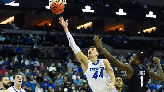 Feb 8, 2022; Omaha, Nebraska, USA;  Creighton Bluejays forward Ryan Hawkins (44) scores against Butler Bulldogs guard Bo Hodges (1) in the second half at CHI Health Center Omaha. Mandatory Credit: Steven Branscombe-USA TODAY Sports