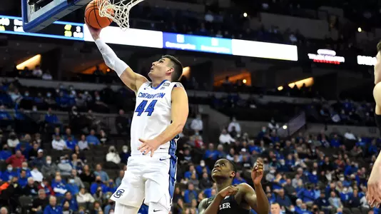 Feb 8, 2022; Omaha, Nebraska, USA; Creighton Bluejays forward Ryan Hawkins (44) scores against Butler Bulldogs guard Bo Hodges (1) in the second half at CHI Health Center Omaha. Mandatory Credit: Steven Branscombe-USA TODAY Sports