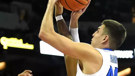 Feb 8, 2022; Omaha, Nebraska, USA;  Creighton Bluejays forward Ryan Hawkins (44) scores against Butler Bulldogs guard Jayden Taylor (13) in the second half at CHI Health Center Omaha. Mandatory Credit: Steven Branscombe-USA TODAY Sports
