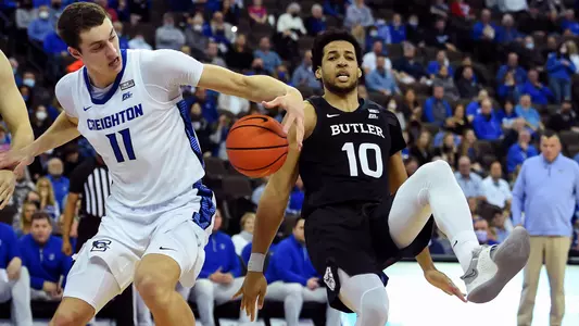 Feb 8, 2022; Omaha, Nebraska, USA;  Creighton Bluejays center Ryan Kalkbrenner (11) grabs a ball from Butler Bulldogs forward Bryce Nze (10) in the second half at CHI Health Center Omaha. Mandatory Credit: Steven Branscombe-USA TODAY Sports