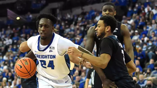 Feb 8, 2022; Omaha, Nebraska, USA;  Creighton Bluejays forward Arthur Kaluma (24) drives against Butler Bulldogs guard Aaron Thompson (2) in the first half at CHI Health Center Omaha. Mandatory Credit: Steven Branscombe-USA TODAY Sports