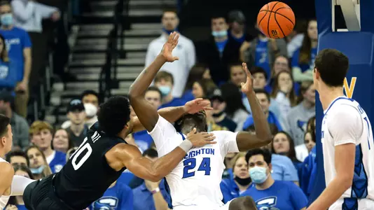 Feb 8, 2022; Omaha, Nebraska, USA;  Creighton Bluejays forward Arthur Kaluma (24) is called for a foul against Butler Bulldogs forward Bryce Nze (10) in the second half at CHI Health Center Omaha. Mandatory Credit: Steven Branscombe-USA TODAY Sports