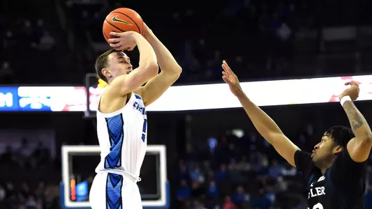 Feb 8, 2022; Omaha, Nebraska, USA;  Creighton Bluejays guard Alex O'Connell (5) attempts a shot against Butler Bulldogs guard Jayden Taylor (13) in the first half at CHI Health Center Omaha. Mandatory Credit: Steven Branscombe-USA TODAY Sports