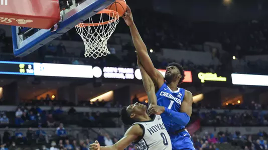 Feb 14, 2022; Omaha, Nebraska, USA; Creighton Bluejays forward KeyShawn Feazell (1) dunks over Georgetown Hoyas guard Aminu Mohammed (0) in the second half at CHI Health Center Omaha. Mandatory Credit: Steven Branscombe-USA TODAY Sports