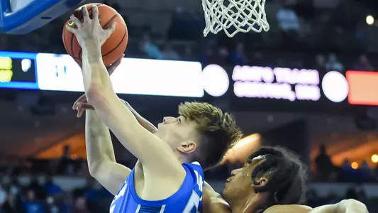 Feb 14, 2022; Omaha, Nebraska, USA; Creighton Bluejays forward Modestas Kancleris (55) attempts a shot against Georgetown Hoyas forward Jalin Billingsley (4) in the second half at CHI Health Center Omaha. Mandatory Credit: Steven Branscombe-USA TODAY Sports