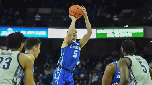 Feb 14, 2022; Omaha, Nebraska, USA;  Creighton Bluejays guard Alex O'Connell (5) scores on a three point attempt against the Georgetown Hoyas in the first half at CHI Health Center Omaha. Mandatory Credit: Steven Branscombe-USA TODAY Sports
