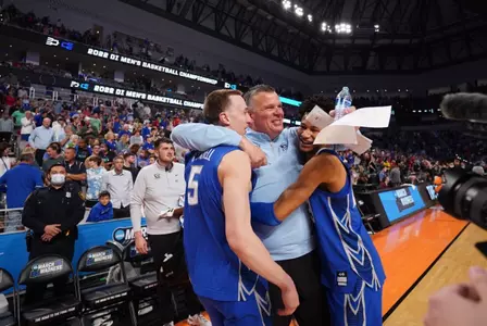 Alex O'Connell, Greg McDermott, Trey Alexander hug