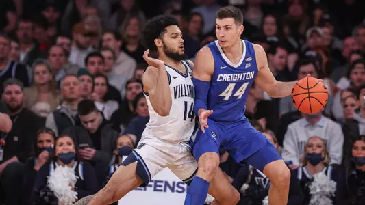 Mar 12, 2022; New York, NY, USA; Creighton Bluejays forward Ryan Hawkins (44) dribbles as Villanova Wildcats guard Caleb Daniels (14) defends during the first half at Madison Square Garden. Mandatory Credit: Vincent Carchietta-USA TODAY Sports