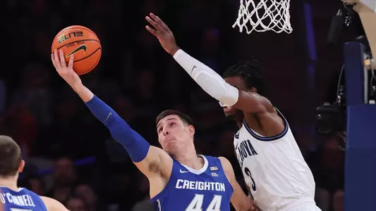Mar 12, 2022; New York, NY, USA; Creighton Bluejays forward Ryan Hawkins (44) rebounds against Villanova Wildcats forward Brandon Slater (3) during the second half at Madison Square Garden. Mandatory Credit: Vincent Carchietta-USA TODAY Sports