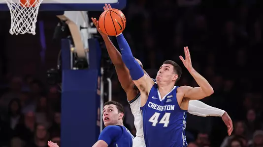 Mar 12, 2022; New York, NY, USA; Creighton Bluejays forward Ryan Hawkins (44) rebounds against Villanova Wildcats forward Eric Dixon (43) during the second half at Madison Square Garden. Mandatory Credit: Vincent Carchietta-USA TODAY Sports