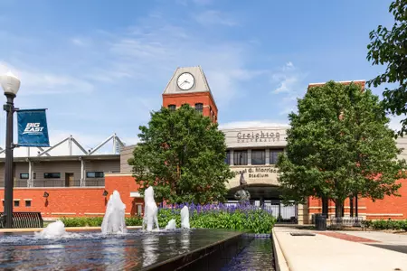 Morrison Stadium with the fountains and statue in front 2022