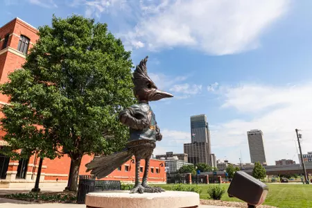 Morrison Stadium Statue with cityscape 2022