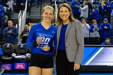 Allison Whitten was honored for her 2,000th career dig prior to the match.