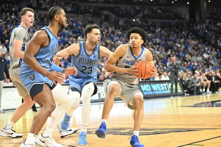 Dec 20, 2023; Omaha, Nebraska, USA; Creighton Bluejays guard Trey Alexander (23) drives against Villanova Wildcats forward Tyler Burton (23) in the second half at CHI Health Center Omaha. Mandatory Credit: Steven Branscombe-USA TODAY Sports
