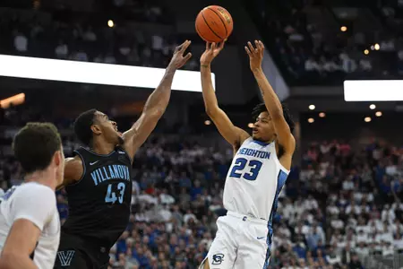 Feb 4, 2023; Omaha, Nebraska, USA; Creighton Bluejays guard Trey Alexander (23) attempts a shot over Villanova Wildcats forward Eric Dixon (43) in the second half at CHI Health Center Omaha. Mandatory Credit: Steven Branscombe-USA TODAY Sports