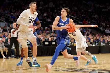 Mar 10, 2023; New York, NY, USA; Creighton Bluejays guard Francisco Farabello (5) drives to the basket against Xavier Musketeers forward Jack Nunge (24) and guard Adam Kunkel (5) during the first half at Madison Square Garden. Mandatory Credit: Brad Penner-USA TODAY Sports