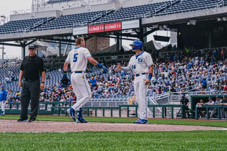 Jack Grace congratulates Ben Gbur after a home run