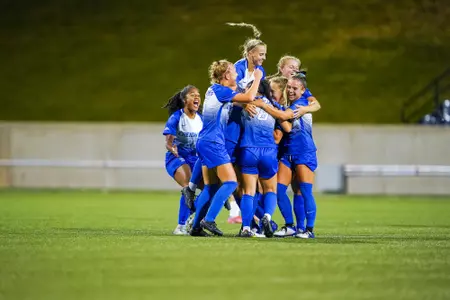 The women's soccer team celebrates a goal made by Peighton Steffan against Connecticut on September 22, 2022.
