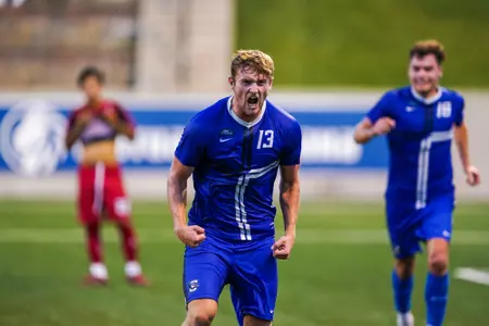 Duncan McGuire celebrates scoring a goal against Rutgers on August 28, 2022. He continued throughout the season to become the NCAA leading goal scorer.