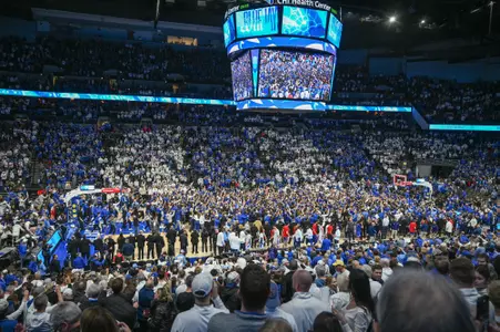 Dec 4, 2024; Omaha, Nebraska, USA; Fans of the Creighton Bluejays rush the court after the win against the Kansas Jayhawks during the second half at CHI Health Center Omaha. Mandatory Credit: Steven Branscombe-Imagn Images