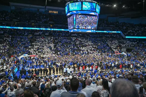 Dec 4, 2024; Omaha, Nebraska, USA; Fans of the Creighton Bluejays rush the court after the win against the Kansas Jayhawks during the second half at CHI Health Center Omaha. Mandatory Credit: Steven Branscombe-Imagn Images