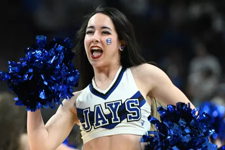 Feb 13, 2024; Omaha, Nebraska, USA; A cheerleader for the Creighton Bluejays performs during a break in the game against the Georgetown Hoyas in the second half at CHI Health Center Omaha. Mandatory Credit: Steven Branscombe-USA TODAY Sports