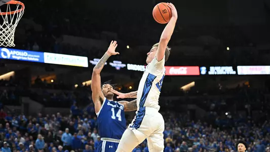 Feb 28, 2024; Omaha, Nebraska, USA; Creighton Bluejays guard Baylor Scheierman (55) drives to the basket against Seton Hall Pirates guard Dre Davis (14) in the second half at CHI Health Center Omaha. Mandatory Credit: Steven Branscombe-USA TODAY Sports