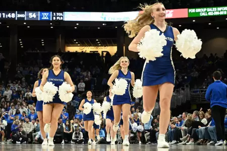 Jan 29, 2025; Omaha, Nebraska, USA;  The Creighton Bluejays cheerleaders take the floor during a break in the game against the Xavier Musketeers during the second half at CHI Health Center Omaha. Mandatory Credit: Steven Branscombe-Imagn Images