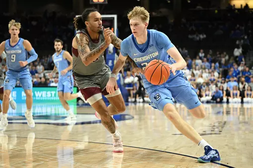 Nov 14, 2025; Omaha, Nebraska, USA; Creighton Bluejays forward Jackson McAndrew (23) drives against Maryland Eastern Shore Hawks forward Dorion Staples (5) during the second half at CHI Health Center Omaha. Mandatory Credit: Steven Branscombe-Imagn Images
