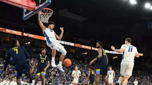 Feb 8, 2025; Omaha, Nebraska, USA; Creighton Bluejays forward Jasen Green (0) dunks against the Marquette Golden Eagles in the second half at CHI Health Center Omaha. Mandatory Credit: Steven Branscombe-Imagn Images