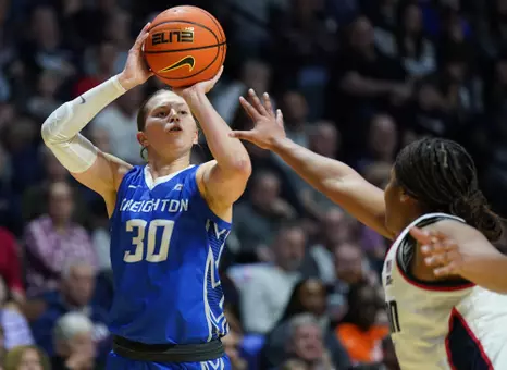Mar 10, 2025; Uncasville, CT, USA; Creighton Bluejays guard Morgan Maly (30) shoots the ball against UConn Huskies forward Sarah Strong (21) in the second half at Mohegan Sun Arena. Mandatory Credit: David Butler II-Imagn Images