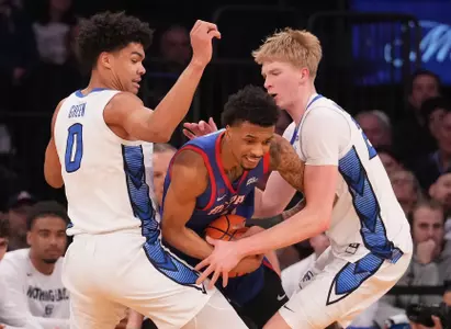 Mar 13, 2025; New York, NY, USA;  Creighton Bluejays forward Jasen Green (0) and forward Jackson McAndrew (23) tie up DePaul Blue Demons guard CJ Gunn (11) during the second halfat Madison Square Garden. Mandatory Credit: Robert Deutsch-Imagn Images